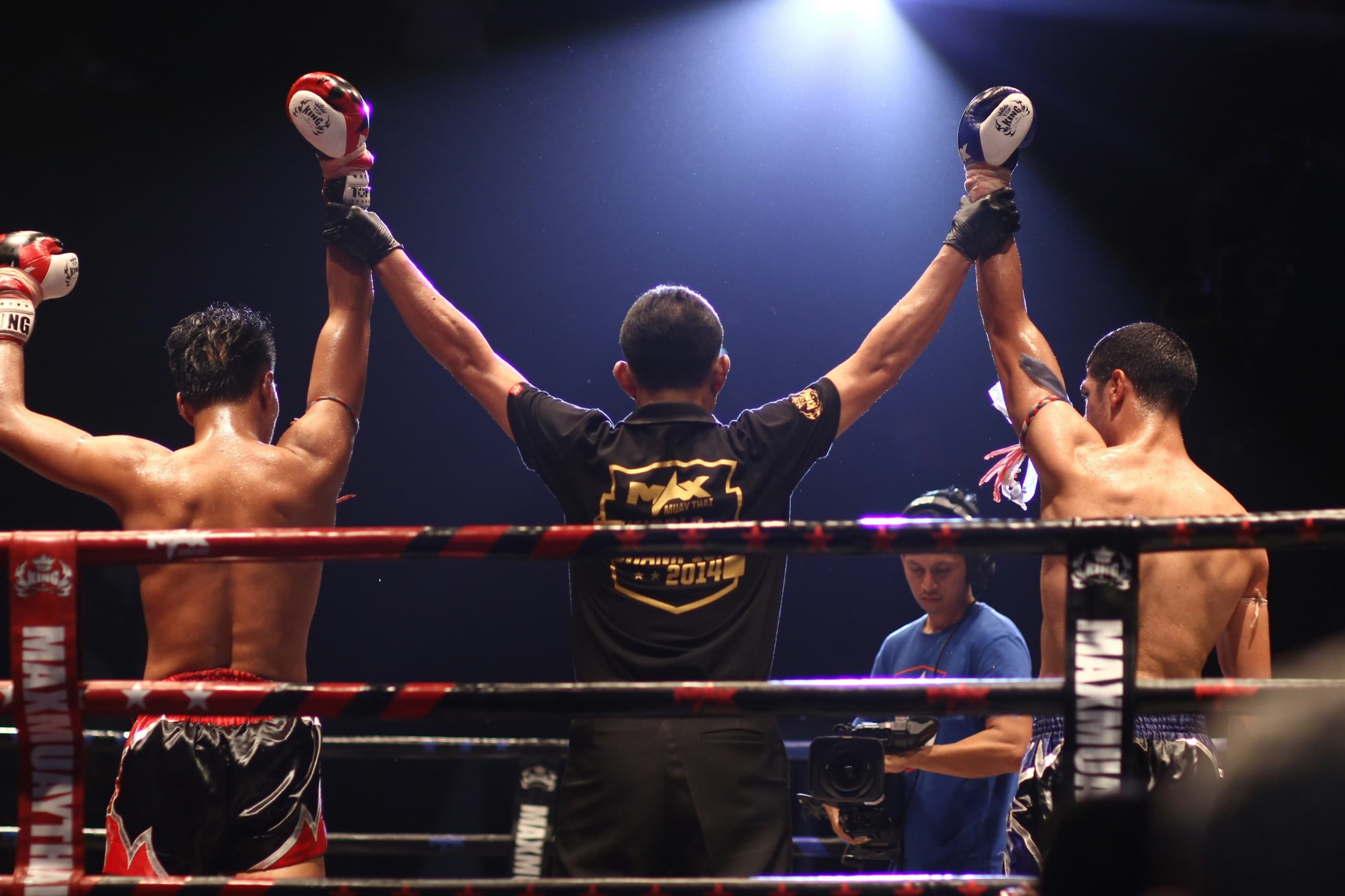 A coach and fighter sparring in the ring